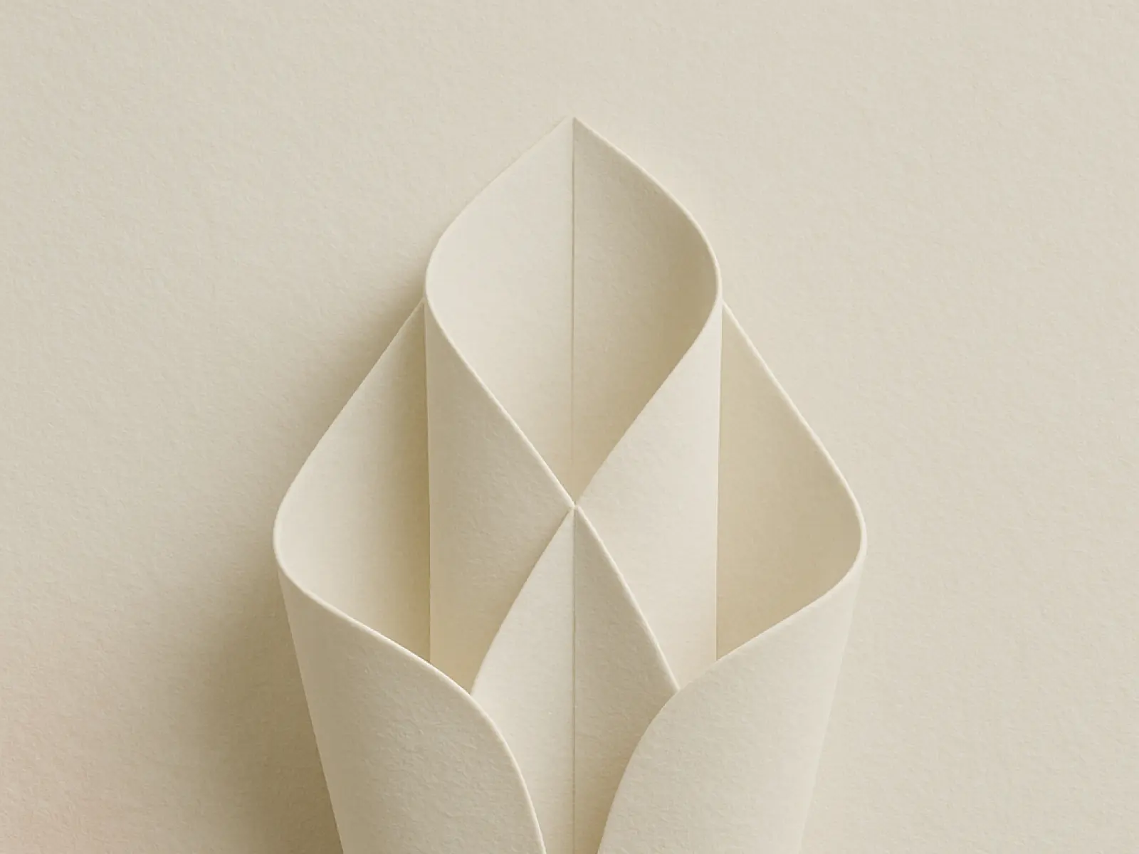 Folded paper design forming petal-like shapes, symbolizing surrogacy and supportive queer pathways to parenthood.
